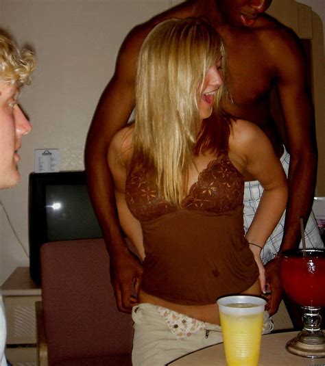 blonde gets a bit flirty with black guy at party at