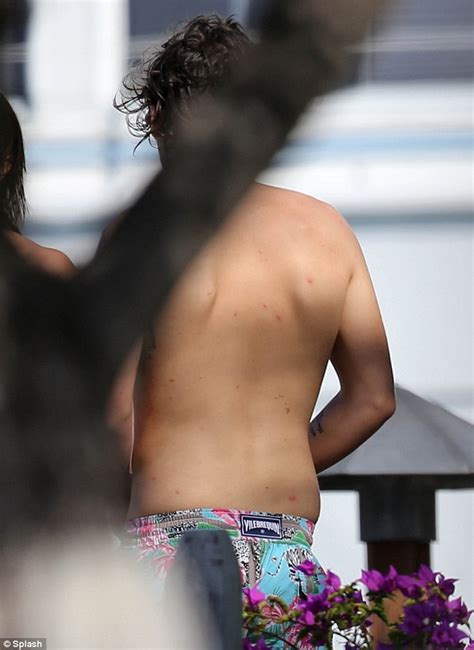 one direction s harry styles shows off topless tattooed body on caribbean holiday daily mail