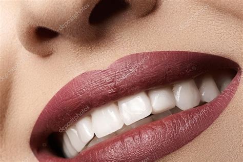 close up happy female smile with healthy white teeth