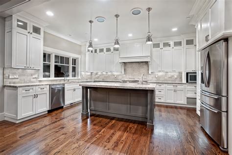 awesome varnished wood flooring  white kitchen themed feat antique white cabinets design