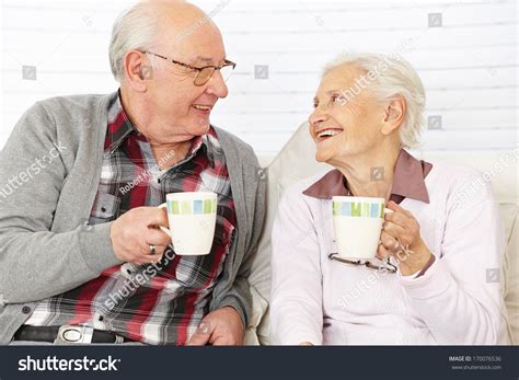 Happy Senior Citizen Couple Drinking Coffee Together Stock