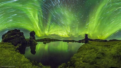 degree panorama showing auroras  star trails  iceland space