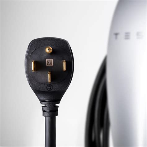 tesla introduces  portable  faster battery charger carscoops