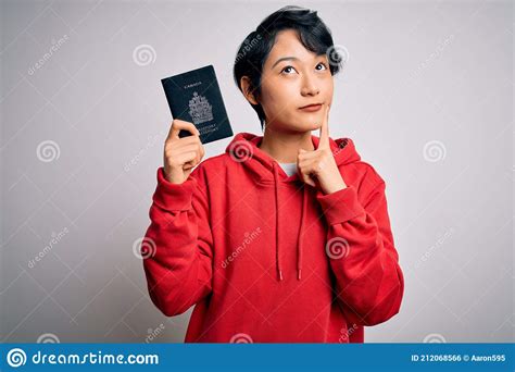 young beautiful chinese tourist woman  vacation holding canada