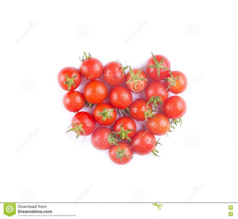 cherry tomatoes in a heart shaped top view isolated i love toma stock