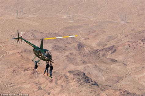 breathtaking video shows gopro bomb squad hanging  helicopters daily mail