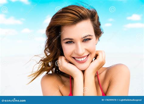 Beautiful Girl In Swimsuit On Beach With Blue Sky And Clouds Stock