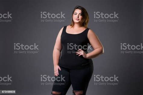 Plus Size Fashion Model In Casual Clothes Fat Woman On Gray Background