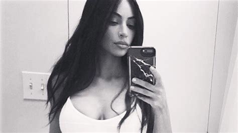 Kim Kardashian’s White Bathing Suit Wears See Through One