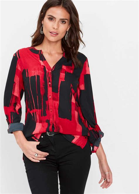prachtig gedessineerde blouse  een langer model roodzwart