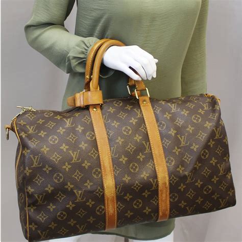 louis vuitton keepall  monogram bandouliere duffle travel bag