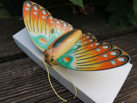 butterfly butterfly tin toy toy  wind  tin toy turns  tin toy