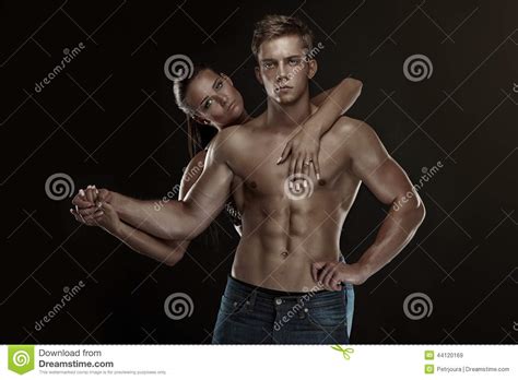 Sexy Couple Beautiful Woman Holding A Muscular Man