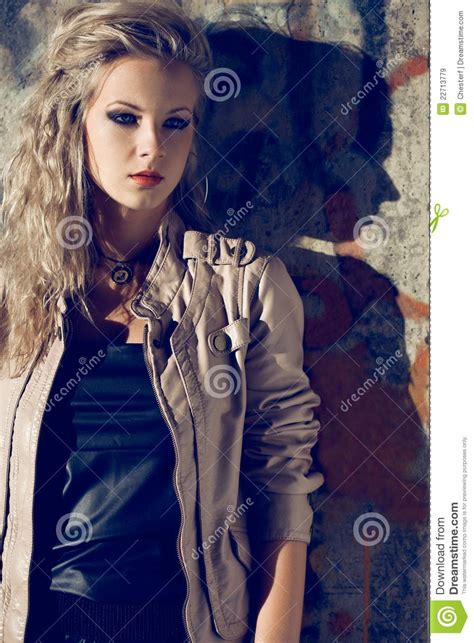 beautiful blond woman wearing leather jacket royalty free