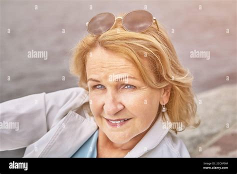 Attractive Senior Active Caucasian Woman About 62 Years Old With Blond