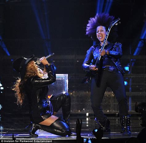 beyonce dons thigh high leather boots despite the controversy over her barely there costumes