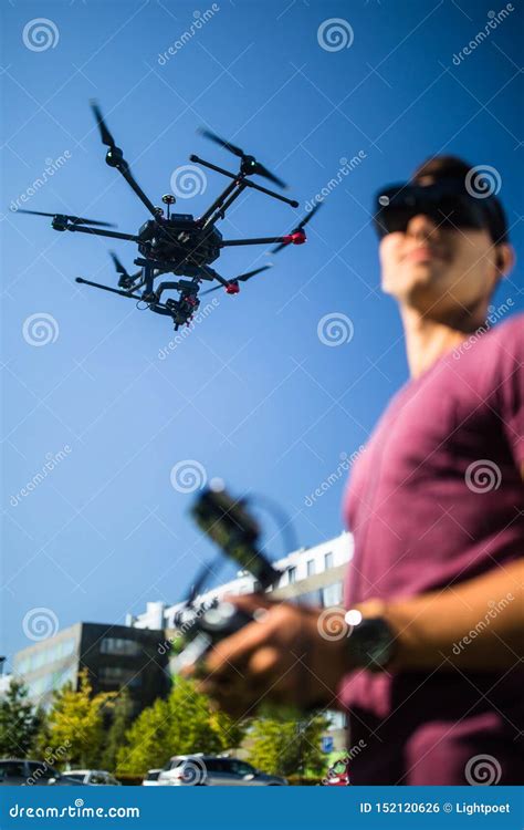 handsome young man flying  drone outdoors stock photo image  gadget flying