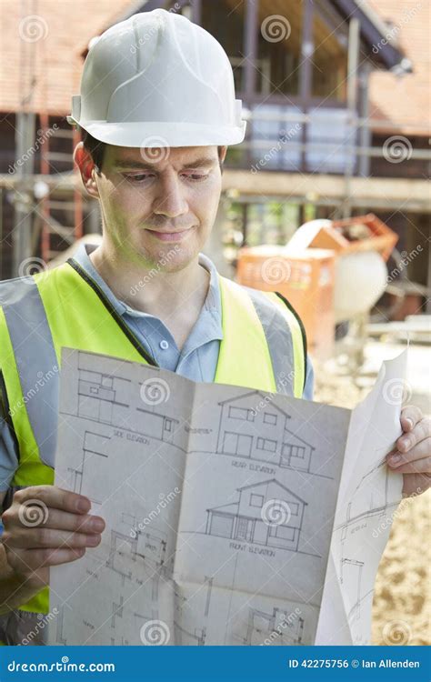 construction worker  building site   house plans stock photo