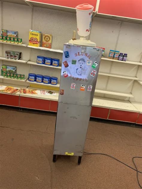 vintage stoelting  slush puppie machine   large coloplast signs