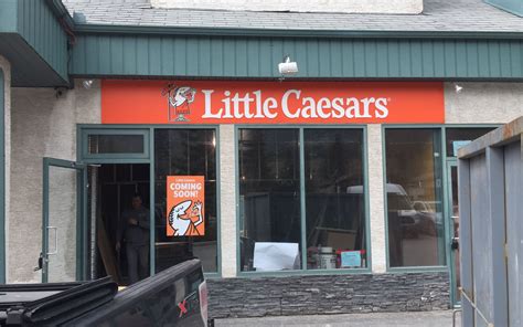 caesars pizza universal sign group
