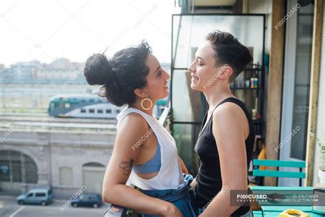 Smiling Lesbian Women Talking In Balcony — Caucasian Emotional Stock