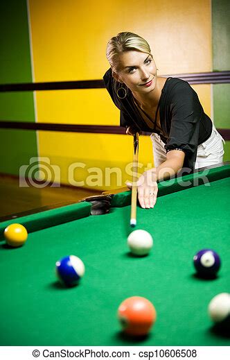beautiful blond woman playing billiards canstock
