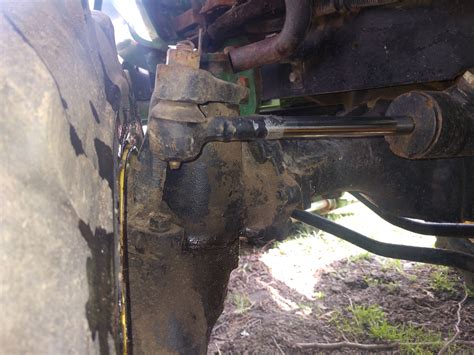 john deere  front left axle leaking  popping  turning