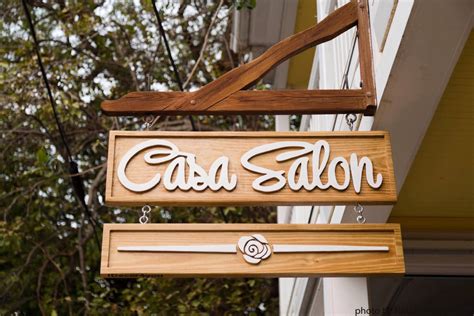 carved wood business sign advertising outdoor signage company