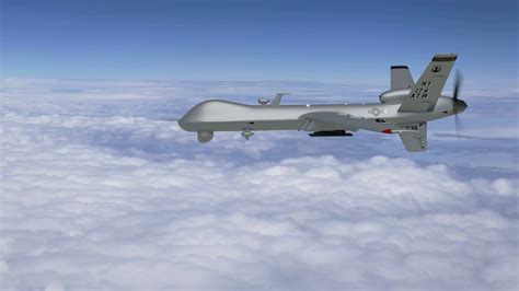 mq  reaper drone flying   sky  surveillance camera rotating