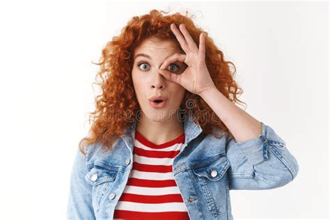 amusement surprise emotions concept amazed attractive redhead curly