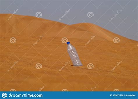 desert sand  blue sky   empty plastic bottle stock photo image  desert outdoor
