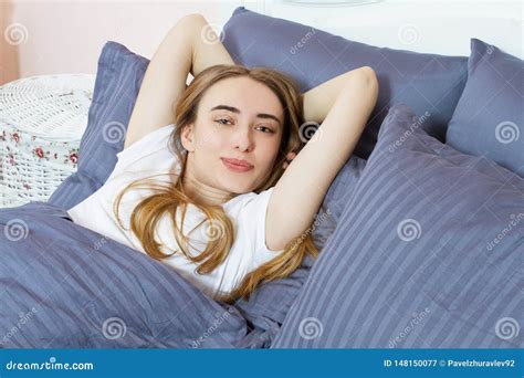 Beautiful Young Dreaming Girl Lying In Her Bed In The Morning With