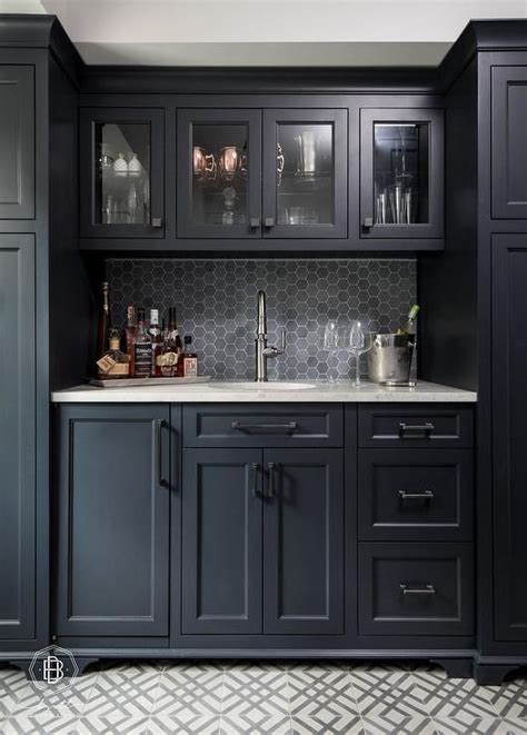 black hexagon tiles  black shaker cabinets transitional kitchen