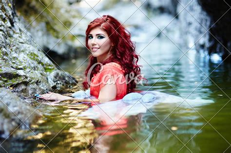 sexy redhead standing in water photos by canva