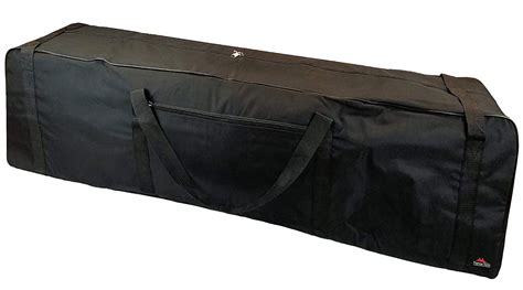 large black bag sitting  top   white floor