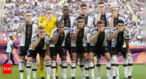 german football team players silent protest cover mouths  team