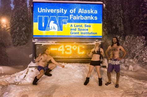 fairbanks alaska   school tradition  pose  front  universitys sign