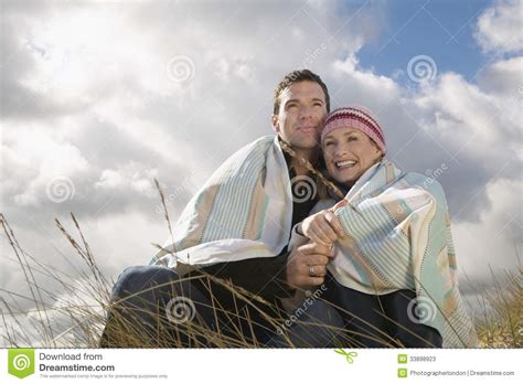 couple wrapped in blanket outdoors stock image image of love bonding 33898923