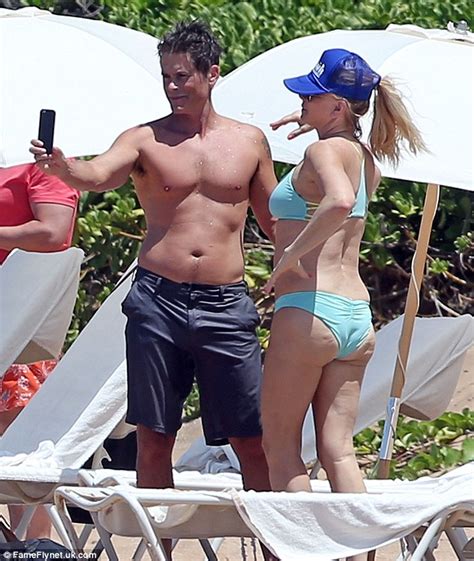 shirtless rob lowe and his bikini clad wife sheryl berkoff get stuck into selfie shoot daily