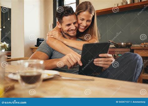 loving young couple catching   social media smiling stock image image  female holding