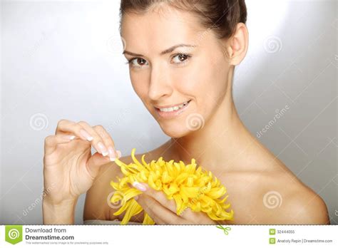 beautiful young woman holding flower stock image image  beauty
