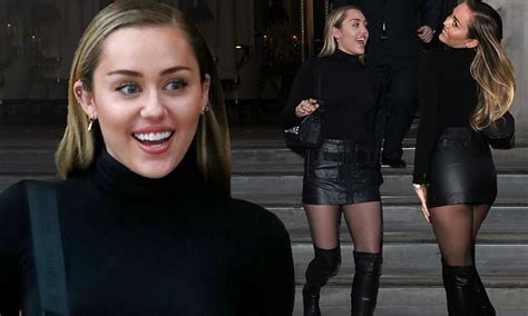miley cyrus sizzles in leather mini skirt and sexy thigh high boots in london daily mail online