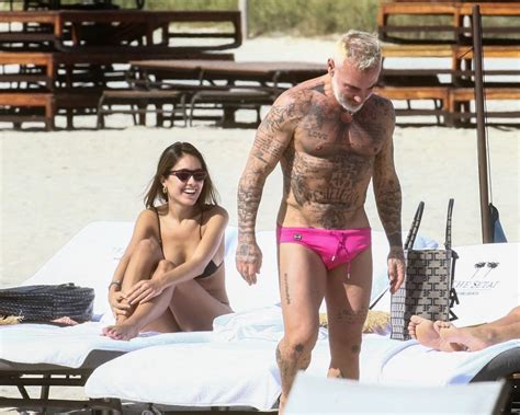 gianluca vacchi and sharon fonseca enjoy a romantic day at the beach in