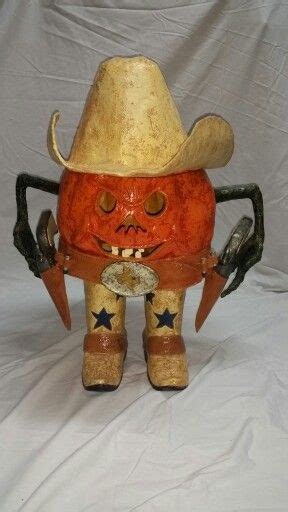 fashioned scarecrow wearing  cowboy hat