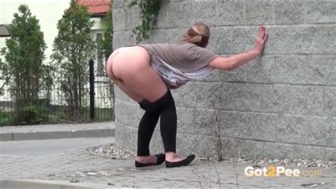 big ass bent over girl takes a pee on the street pissing porn