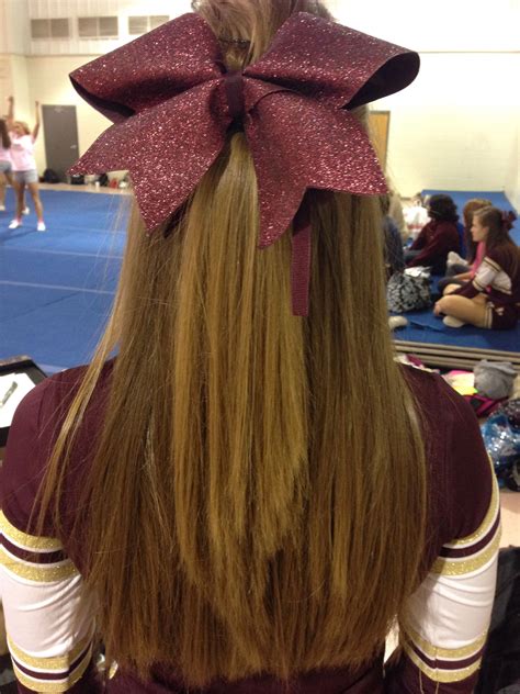 perfect cheer hair for non humid football games straight halfway pulled back with bow cheer