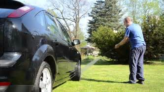 Car Automobile Washing With Strong Water Jet On Garden