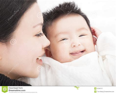 happy asian mother and daughter or son smiling together