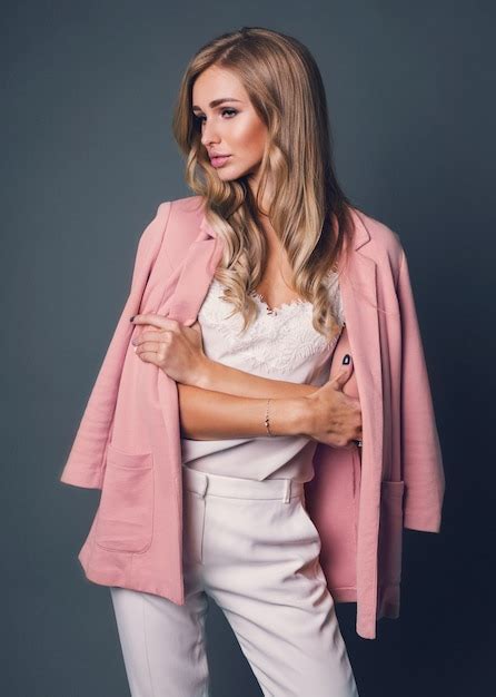 Free Photo Seductive Blonde Woman In Pink Jacket Posing