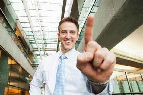 caucasian businessman holding  finger stock photo dissolve